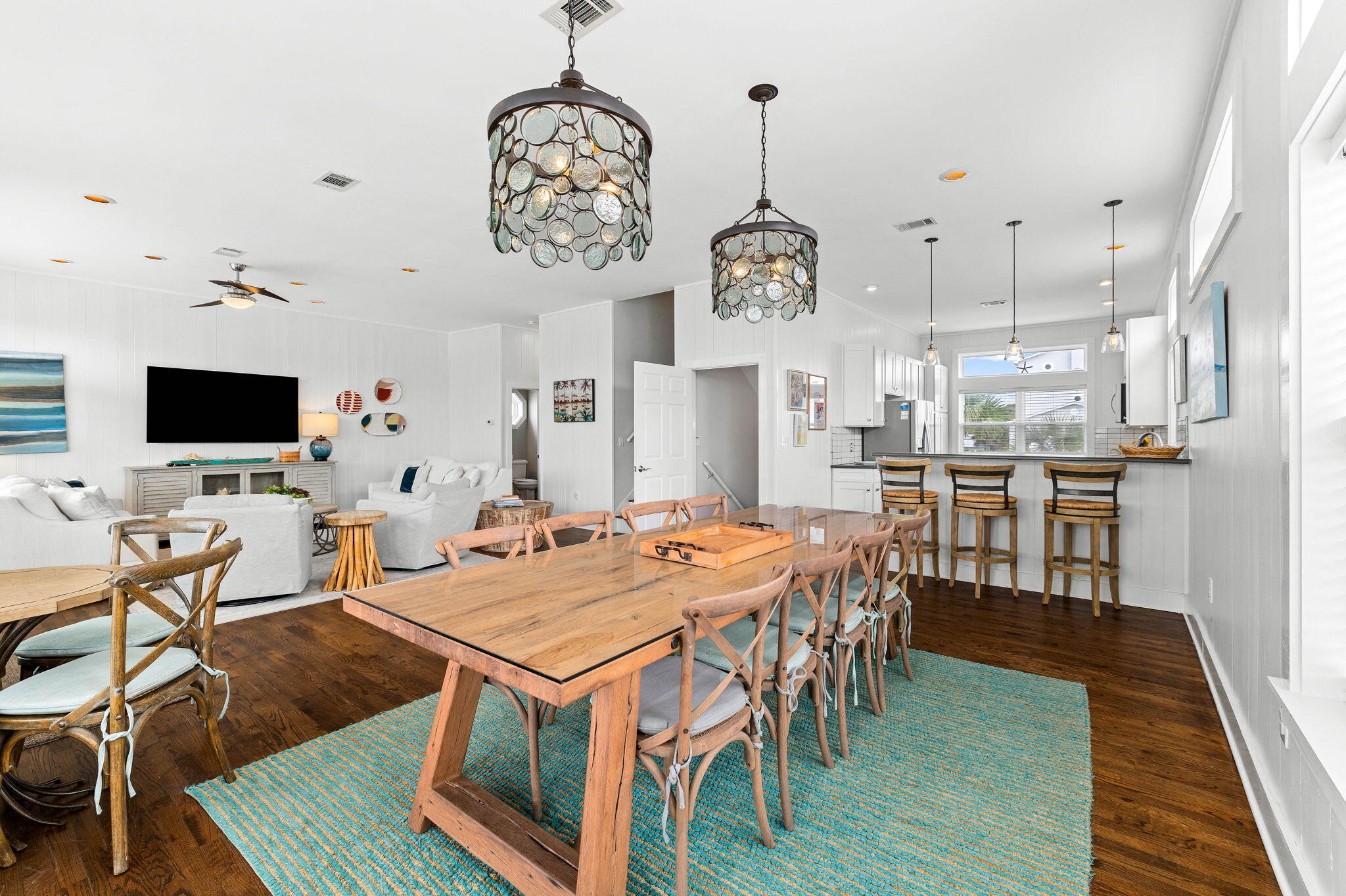 49 Sandy Lane Santa Rosa Beach, FL 32459 - Photo 9 of 73 a view of a dining room with furniture wooden floor and chandelier