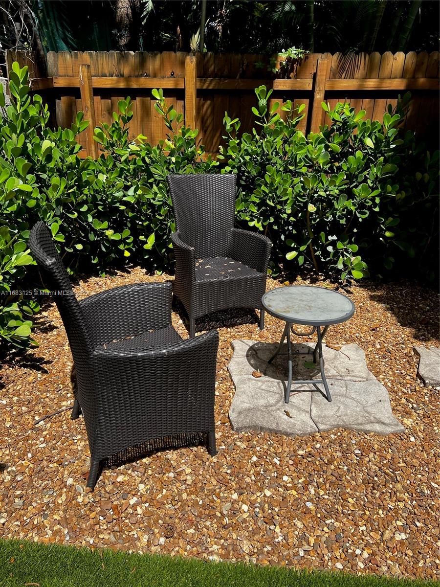 541 Northeast 63rd Street, Unit 3 Miami, FL 33138 - Photo 18 of 19 a outdoor living space with furniture and garden