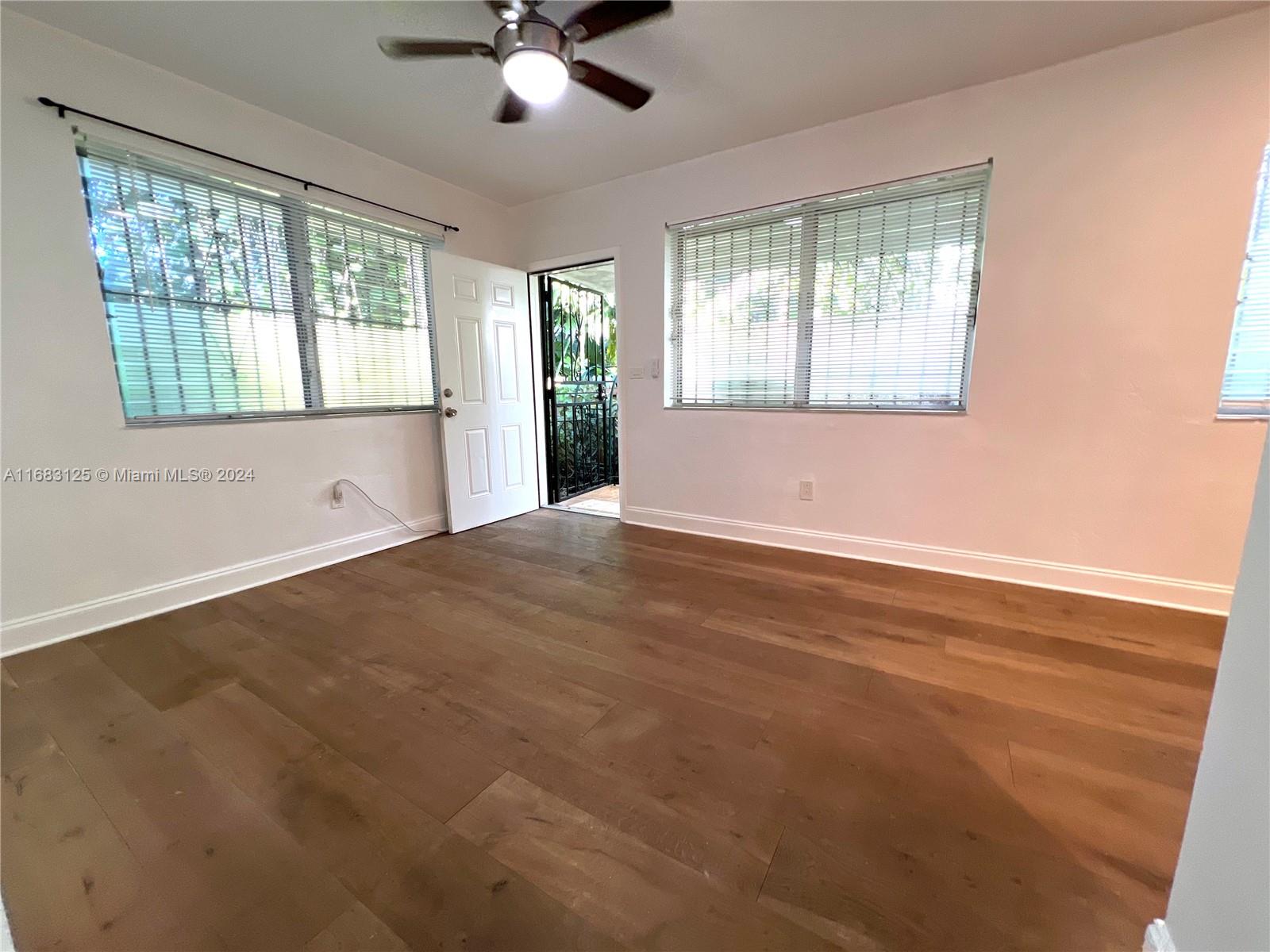 541 Northeast 63rd Street, Unit 3 Miami, FL 33138 - Photo 3 of 19 a view of an empty room with a window