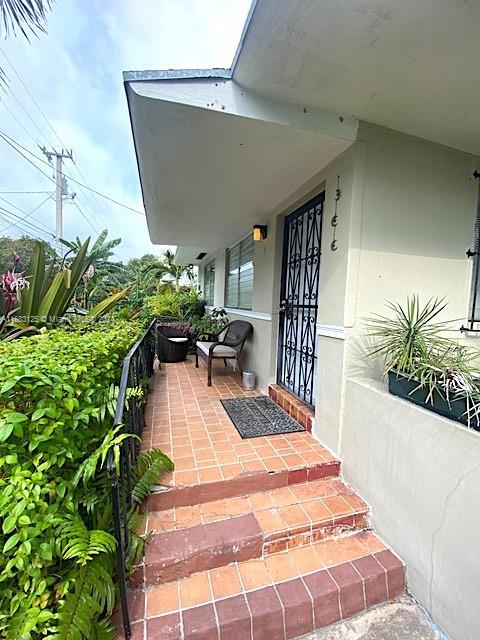 541 Northeast 63rd Street, Unit 3 Miami, FL 33138 - Photo 5 of 19 a lobby with furniture and potted plant