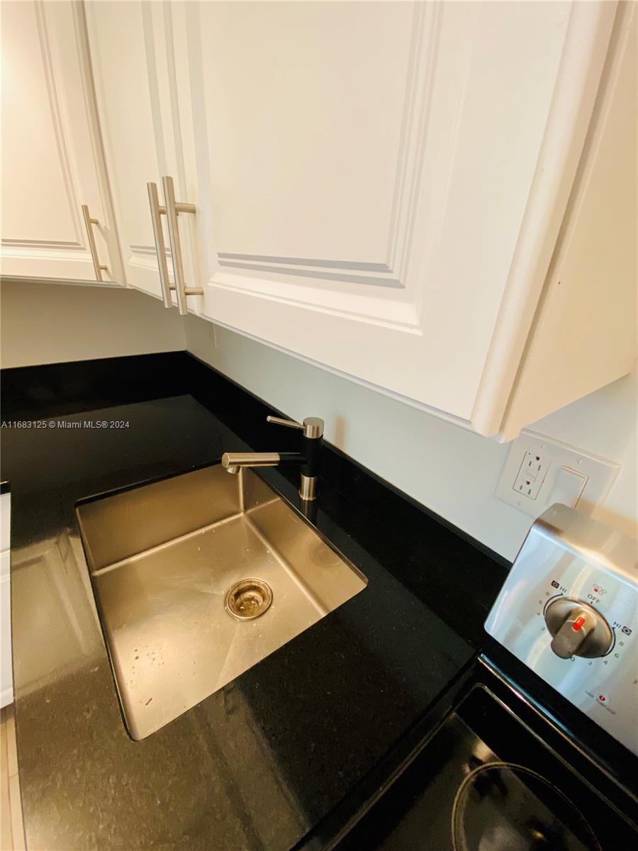 541 Northeast 63rd Street, Unit 3 Miami, FL 33138 - Photo 9 of 19 a bathroom with a sink