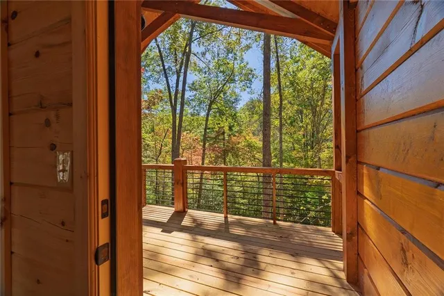 a view of a balcony with wooden floor