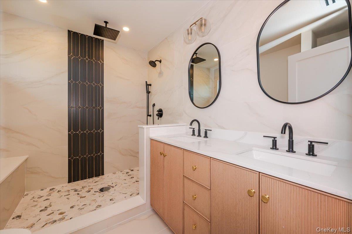 147 West Bayberry Road Islip, NY 11751 - Photo 20 of 31 a bathroom with a sink and a mirror
