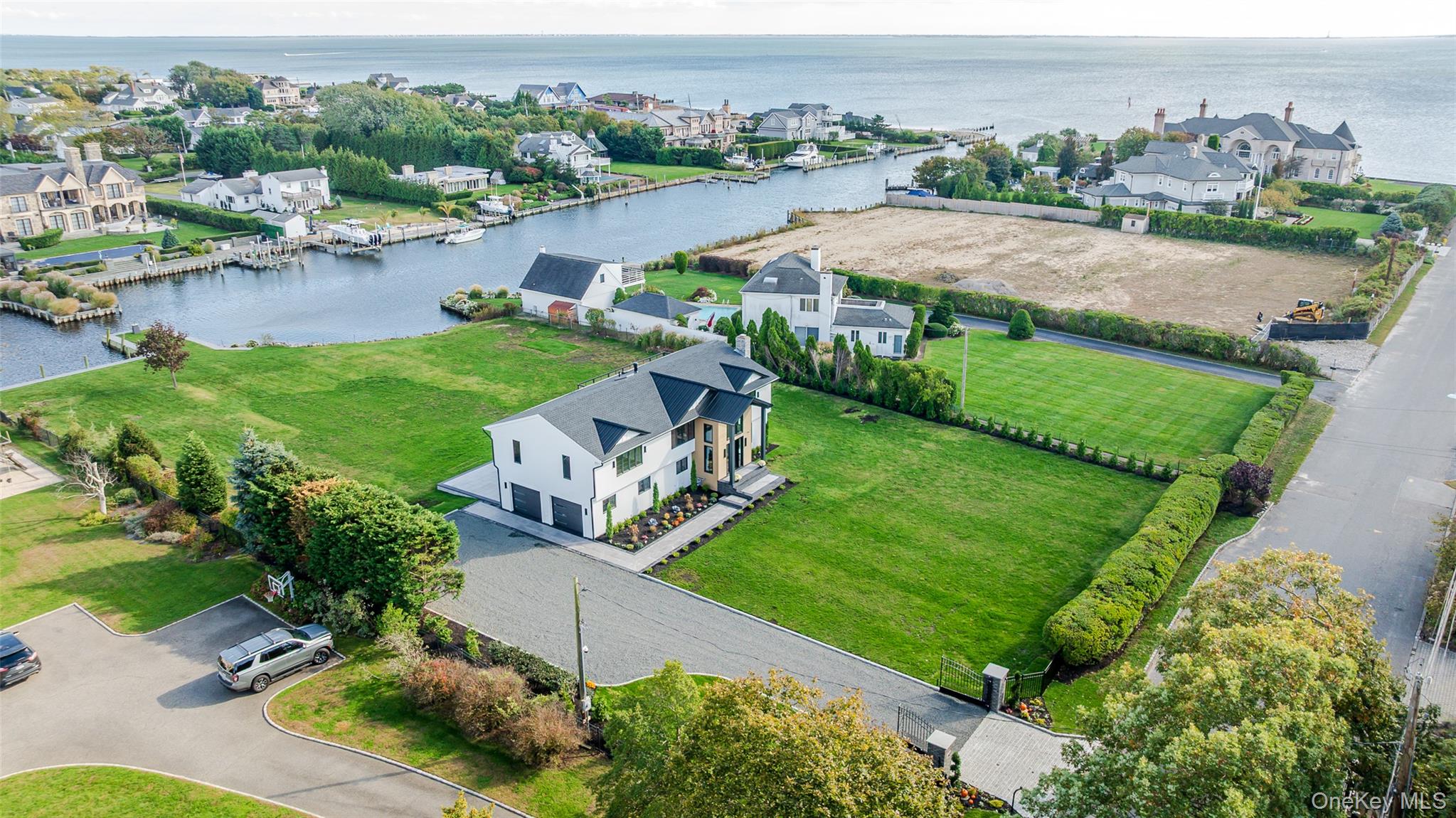 147 West Bayberry Road Islip, NY 11751 - Photo 2 of 31 an aerial view of residential houses with outdoor space and river