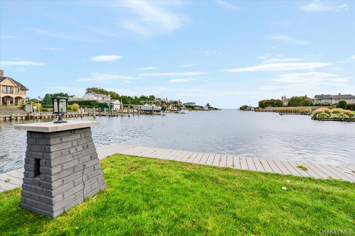147 West Bayberry Road Islip, NY 11751 - Photo 21 of 31 a view of a lake with houses in back