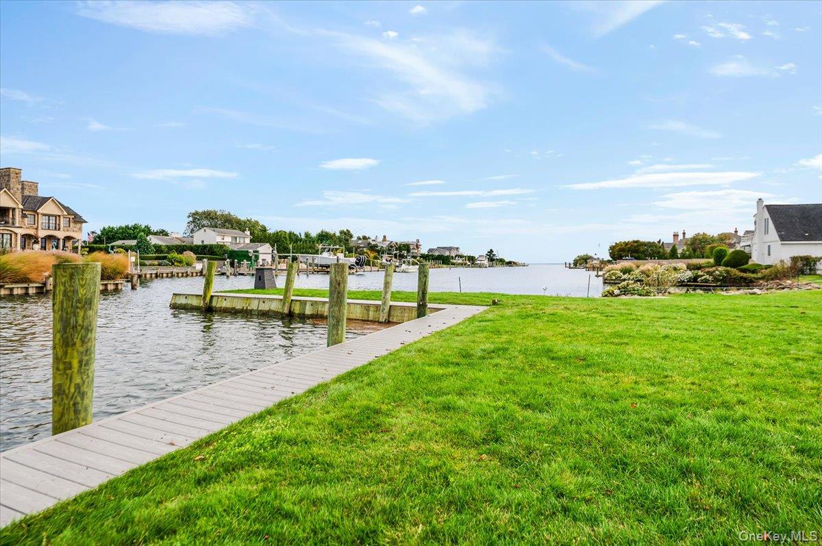 147 West Bayberry Road Islip, NY 11751 - Photo 23 of 31 a view of a lake with houses in back