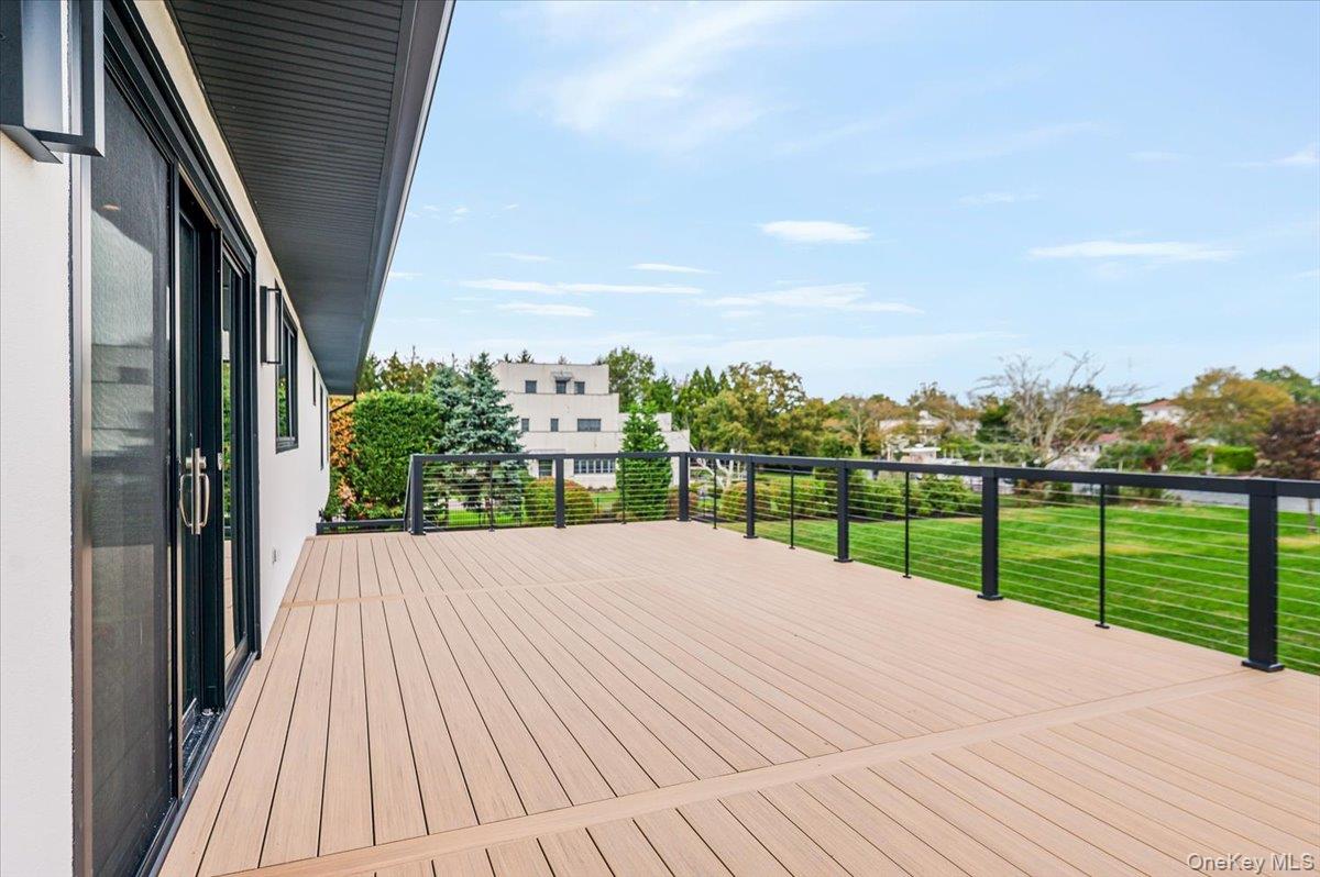147 West Bayberry Road Islip, NY 11751 - Photo 25 of 31 a view of a balcony with wooden floor and fence