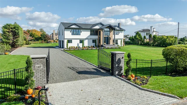 a view of a lake with a flower garden