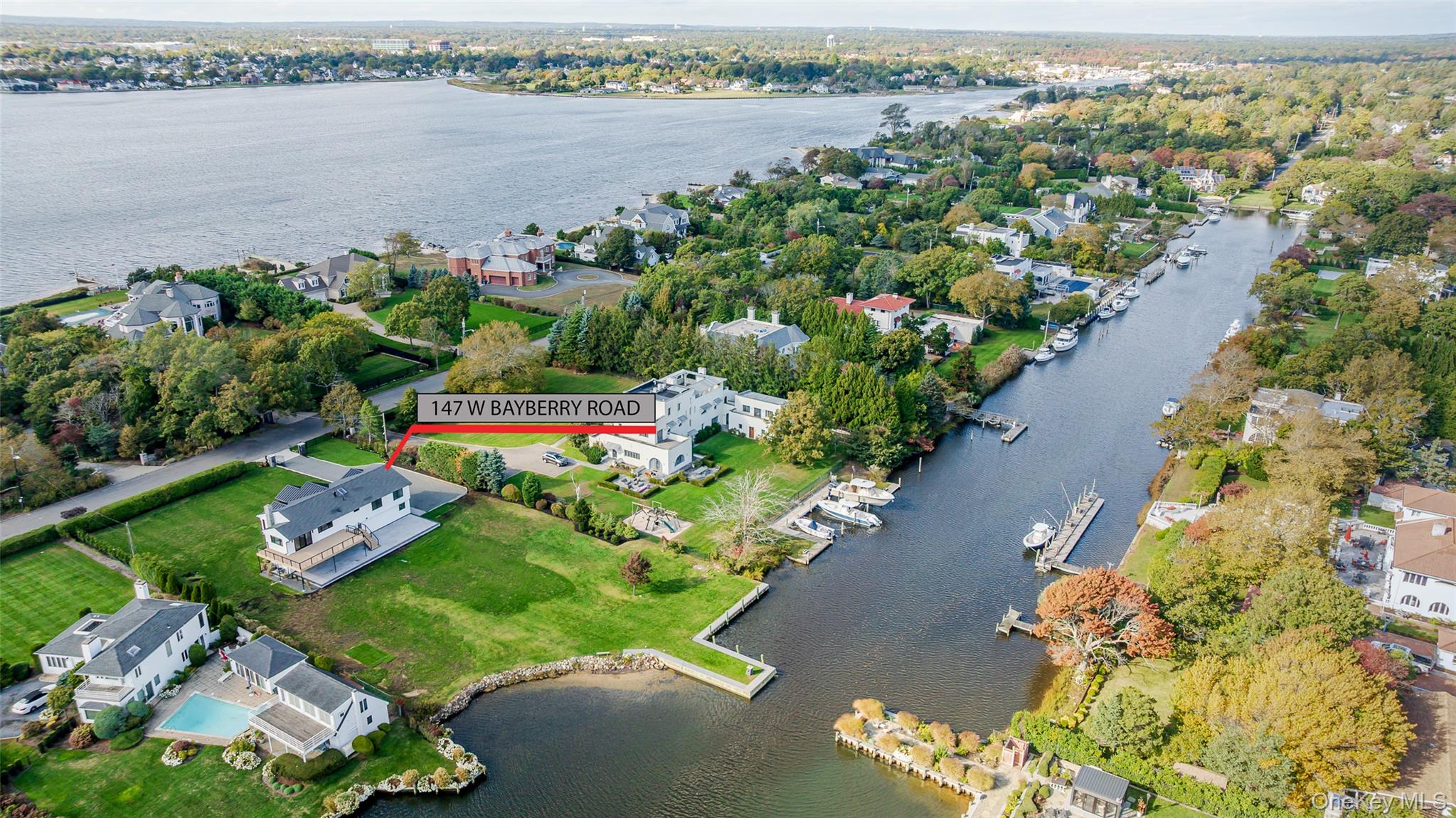 147 West Bayberry Road Islip, NY 11751 - Photo 4 of 31 a view of a lake with a flower garden