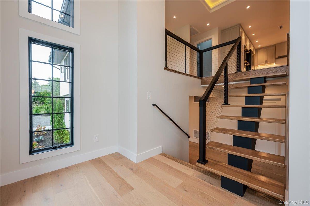 147 West Bayberry Road Islip, NY 11751 - Photo 5 of 31 a view of entryway with a window and wooden floor