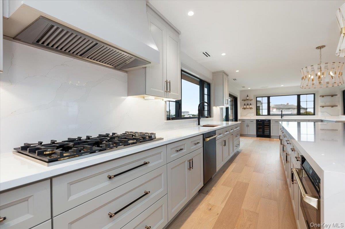 147 West Bayberry Road Islip, NY 11751 - Photo 9 of 31 a large kitchen with stainless steel appliances granite countertop a stove and a sink
