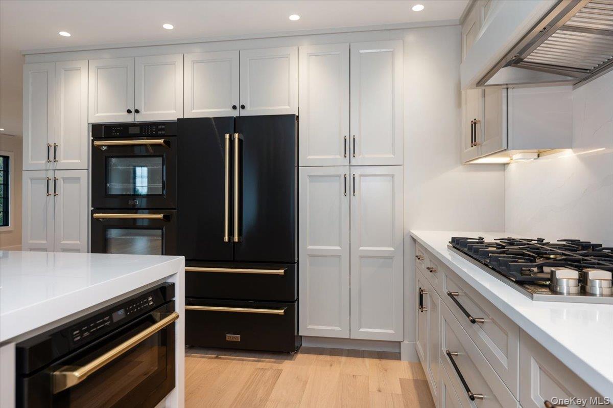 147 West Bayberry Road Islip, NY 11751 - Photo 10 of 31 a kitchen with stainless steel appliances granite countertop a refrigerator and a stove