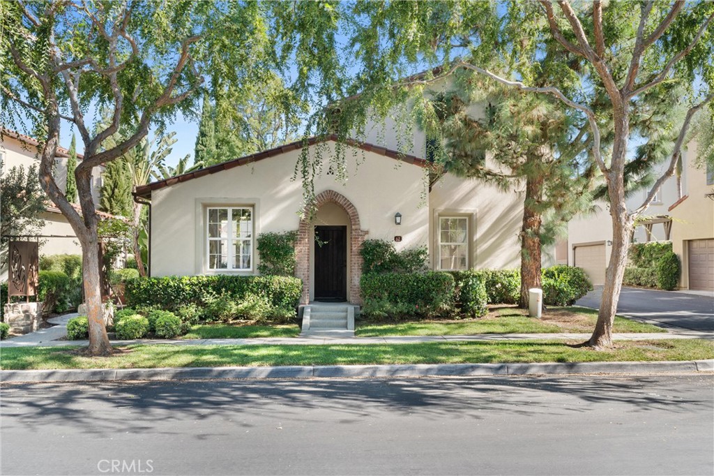 62 Greenhouse Irvine, CA 92603 - Photo 1 of 1 a front view of a house with a yard and potted plants