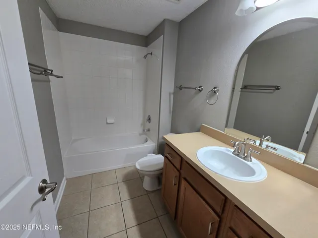 a view of a park with swings and slides