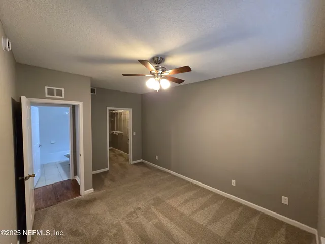 a view of a swimming pool with a lounge chair