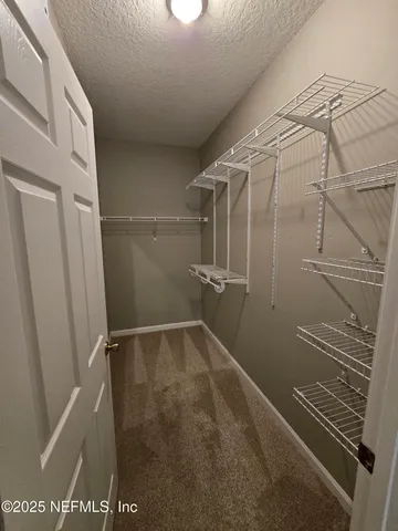 a swimming pool with outdoor seating and yard