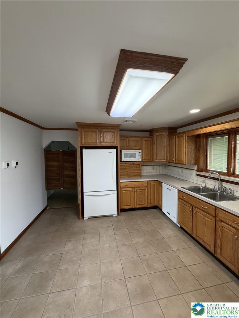 5391 Chapmans Road, Unit 2 Orefield, PA 18069 - Photo 5 of 22 A well-appointed kitchen features ample cabinetry and practical tile flooring.