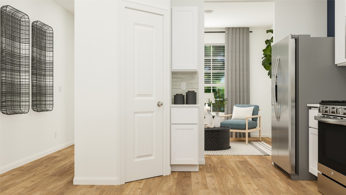 527 Sormonne Loop Kyle, TX 78640 - Photo 14 of 23 a living room with furniture wooden floor and a flat screen tv