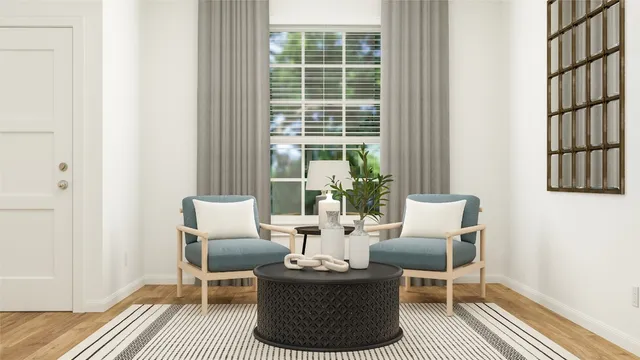 a dining room with furniture and wooden floor