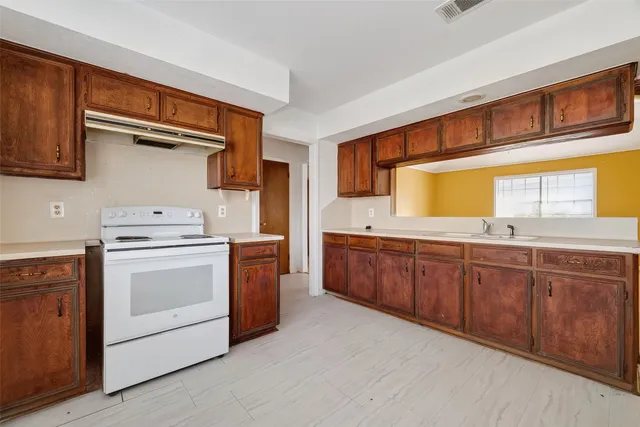 a bathroom with a sink vanity and a mirror