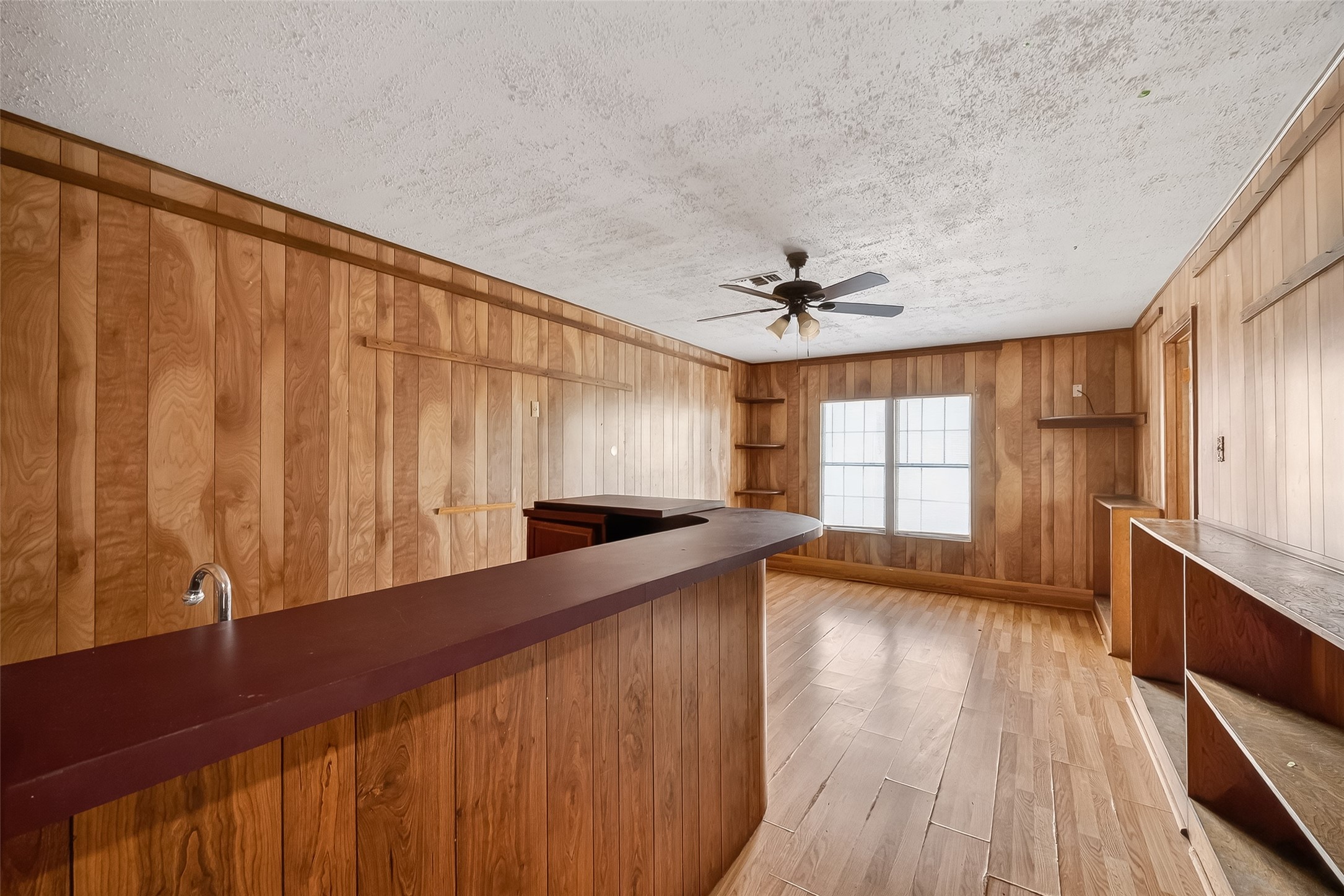 20706 Emerald Street Prairie View, TX 77484 - Photo 23 of 47 a view of a kitchen with a sink and wooden floor
