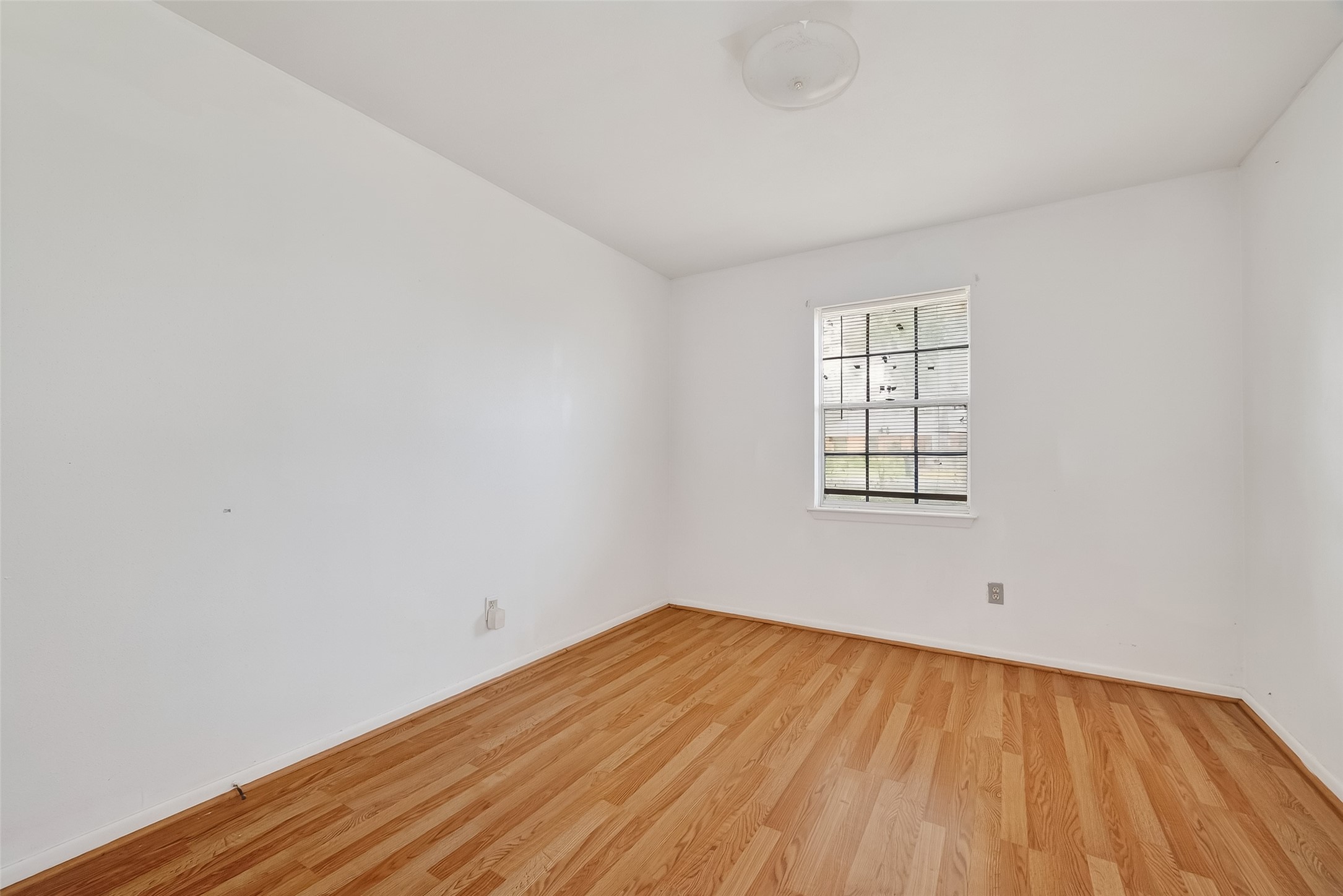 20706 Emerald Street Prairie View, TX 77484 - Photo 35 of 47 a view of empty room with wooden floor and fan