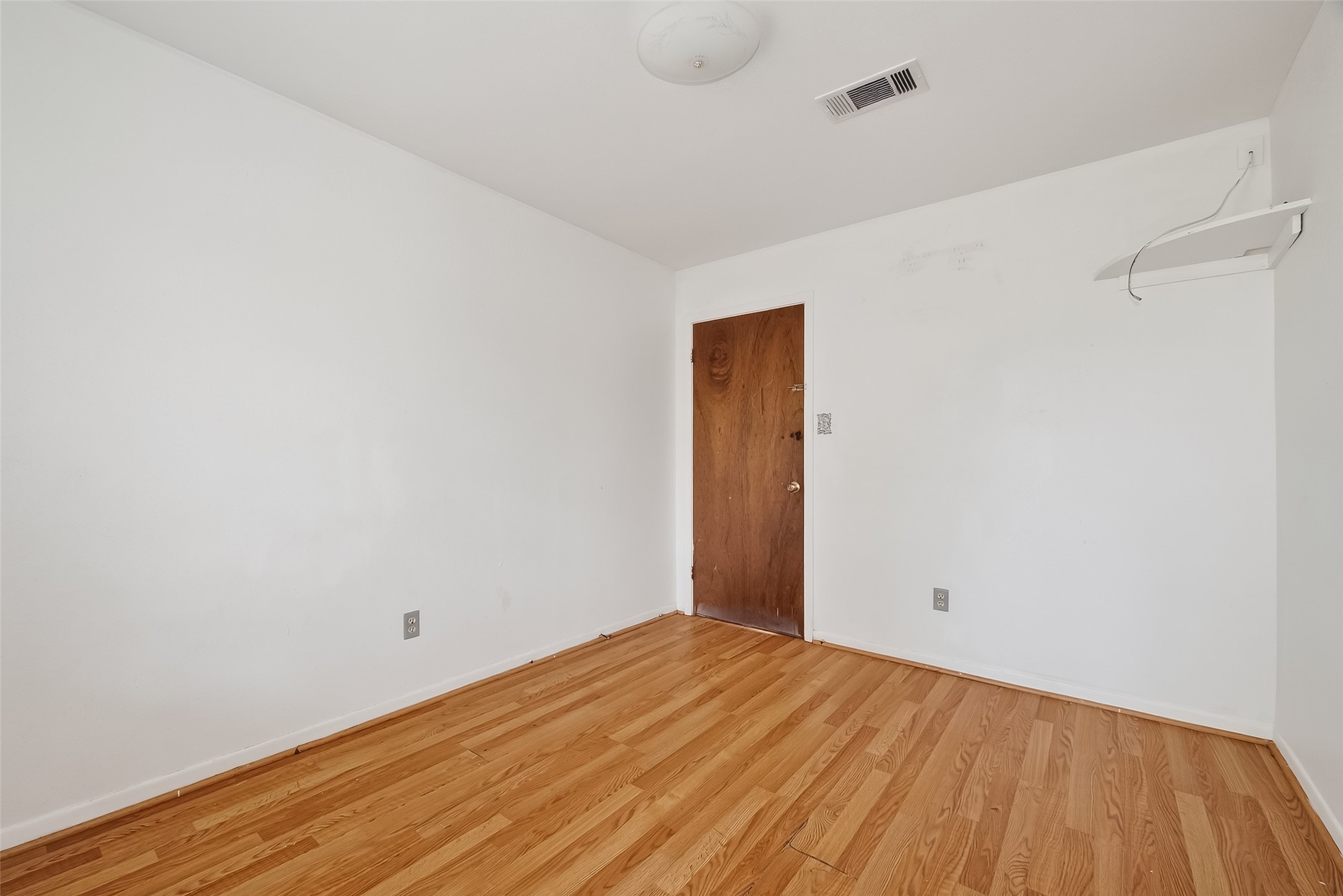 20706 Emerald Street Prairie View, TX 77484 - Photo 37 of 47 a view of empty room with wooden floor