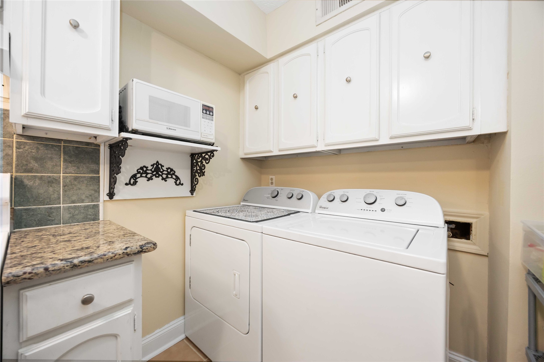 454 North Post Oak Lane Houston, TX 77024 - Photo 12 of 22 a utility room with dryer and washer