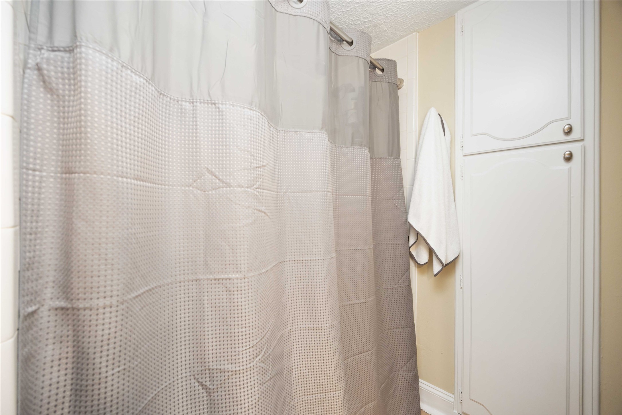454 North Post Oak Lane Houston, TX 77024 - Photo 15 of 22 a bathroom with a shower and a shower curtain