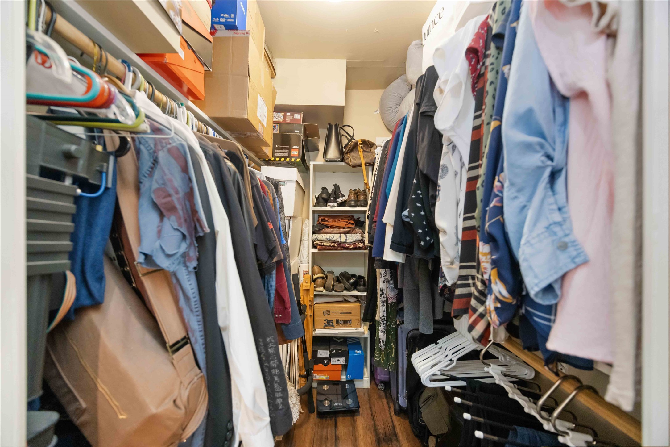 454 North Post Oak Lane Houston, TX 77024 - Photo 16 of 22 a view of walk in closet with clothes