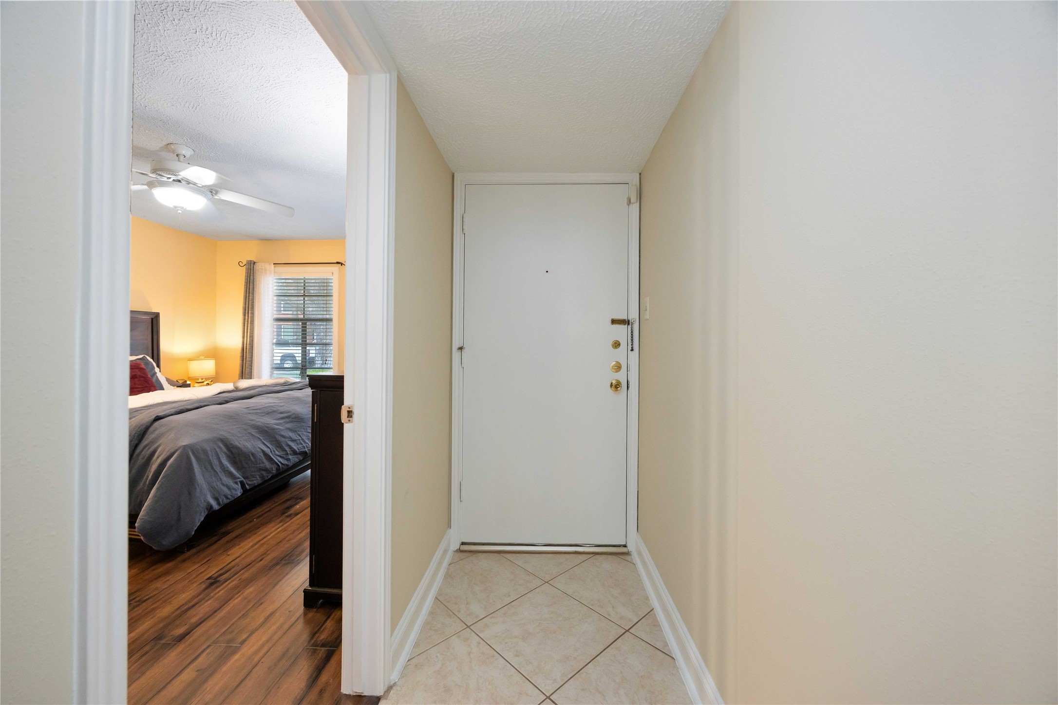 454 North Post Oak Lane Houston, TX 77024 - Photo 18 of 22 a bedroom with a bed and a window