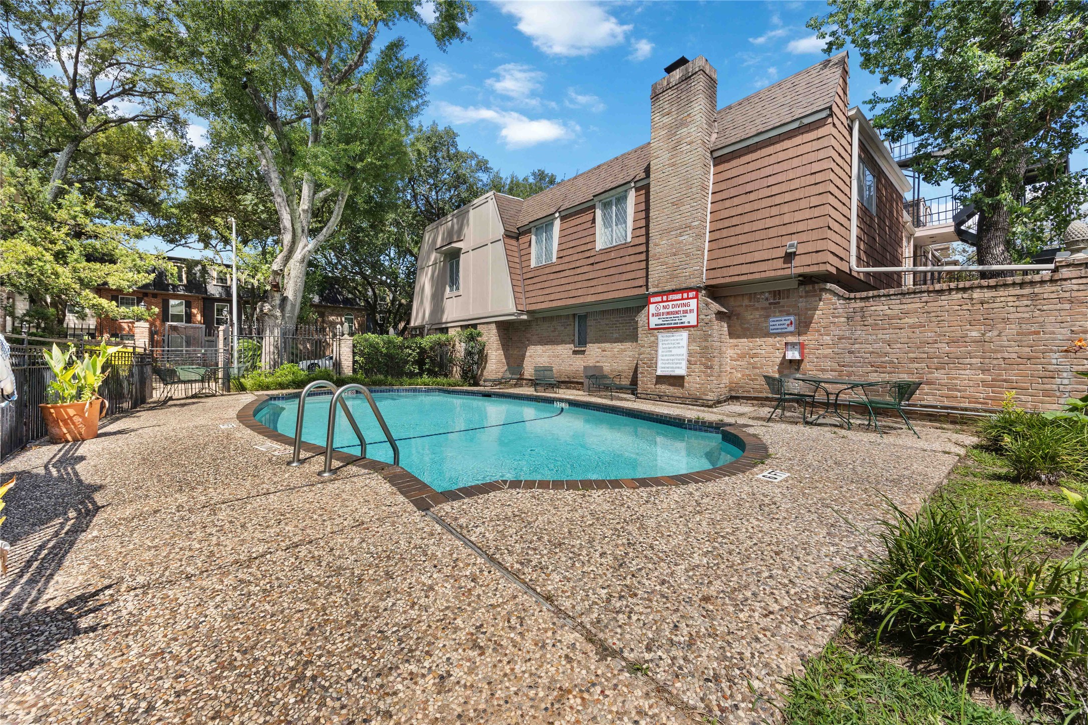 454 North Post Oak Lane Houston, TX 77024 - Photo 20 of 22 a view of a house with a yard