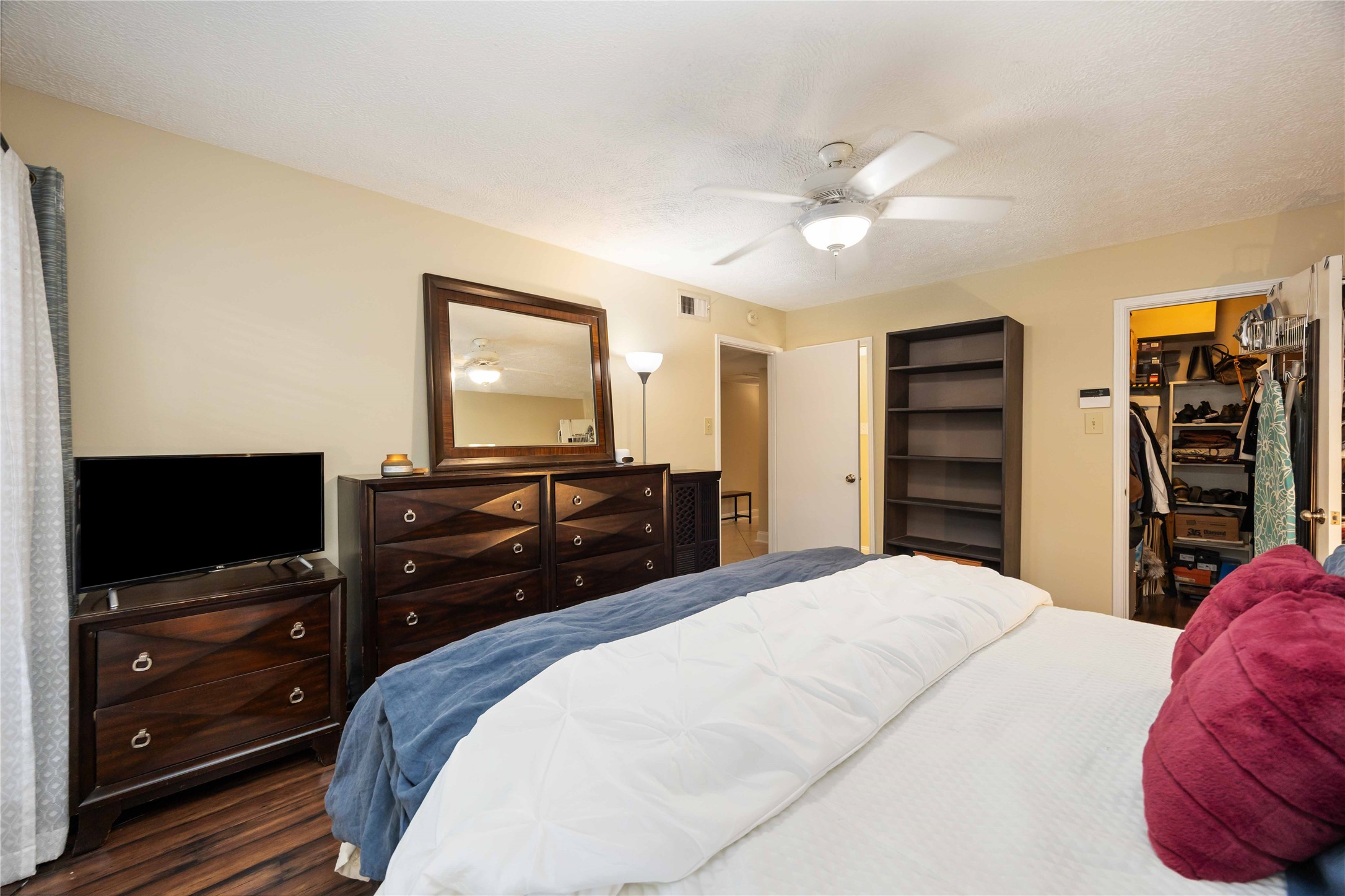 454 North Post Oak Lane Houston, TX 77024 - Photo 3 of 22 a bedroom with a bed and a flat screen tv