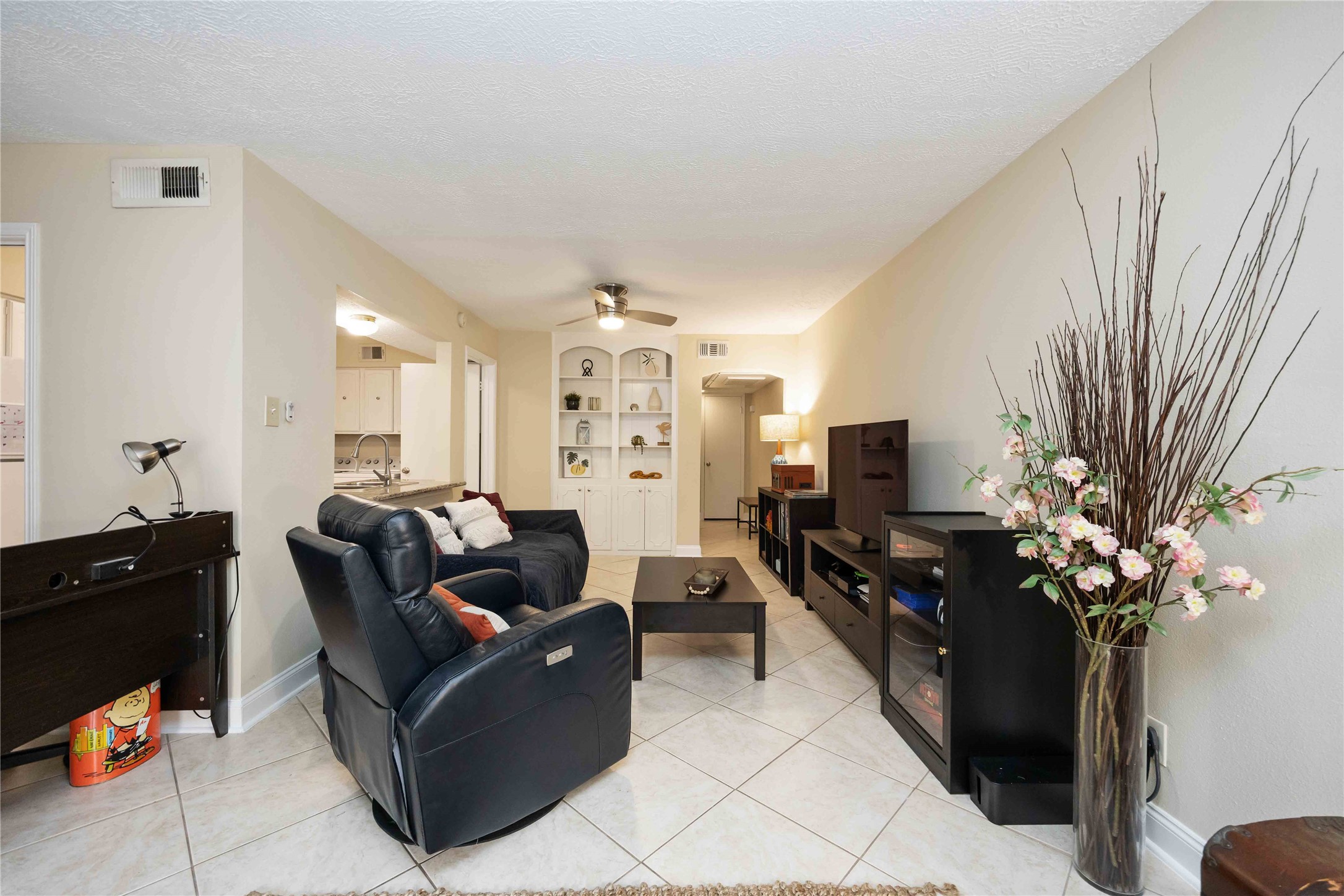 454 North Post Oak Lane Houston, TX 77024 - Photo 6 of 22 a living room with furniture a potted plant and a fireplace