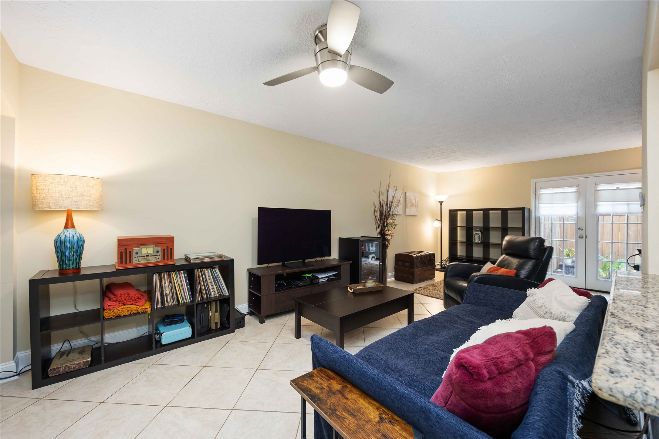 454 North Post Oak Lane Houston, TX 77024 - Photo 8 of 22 a living room with furniture and a flat screen tv