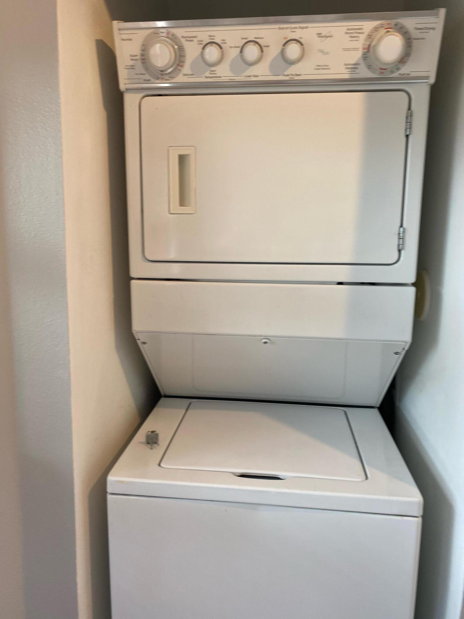 3501 Briar Bay Boulevard, Unit 205 West Palm Beach, FL 33411 - Photo 8 of 8 a utility room with dryer and washer