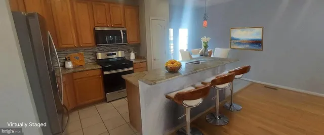 a kitchen with a sink appliances and cabinets