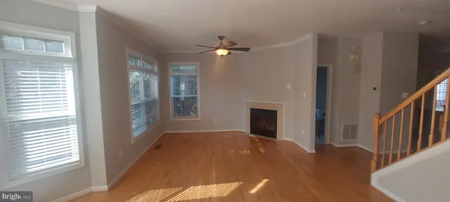 a kitchen with stainless steel appliances a refrigerator a stove a microwave and cabinets