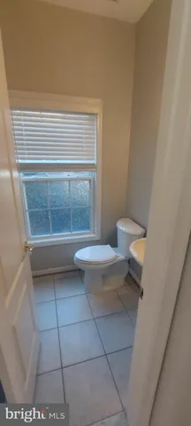 a kitchen with granite countertop a stove and a sink with granite countertops