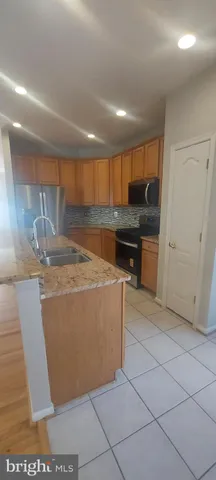 a view of an empty room and wooden floor