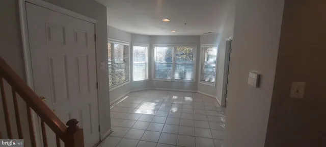 a view of entryway with window and ceiling fan