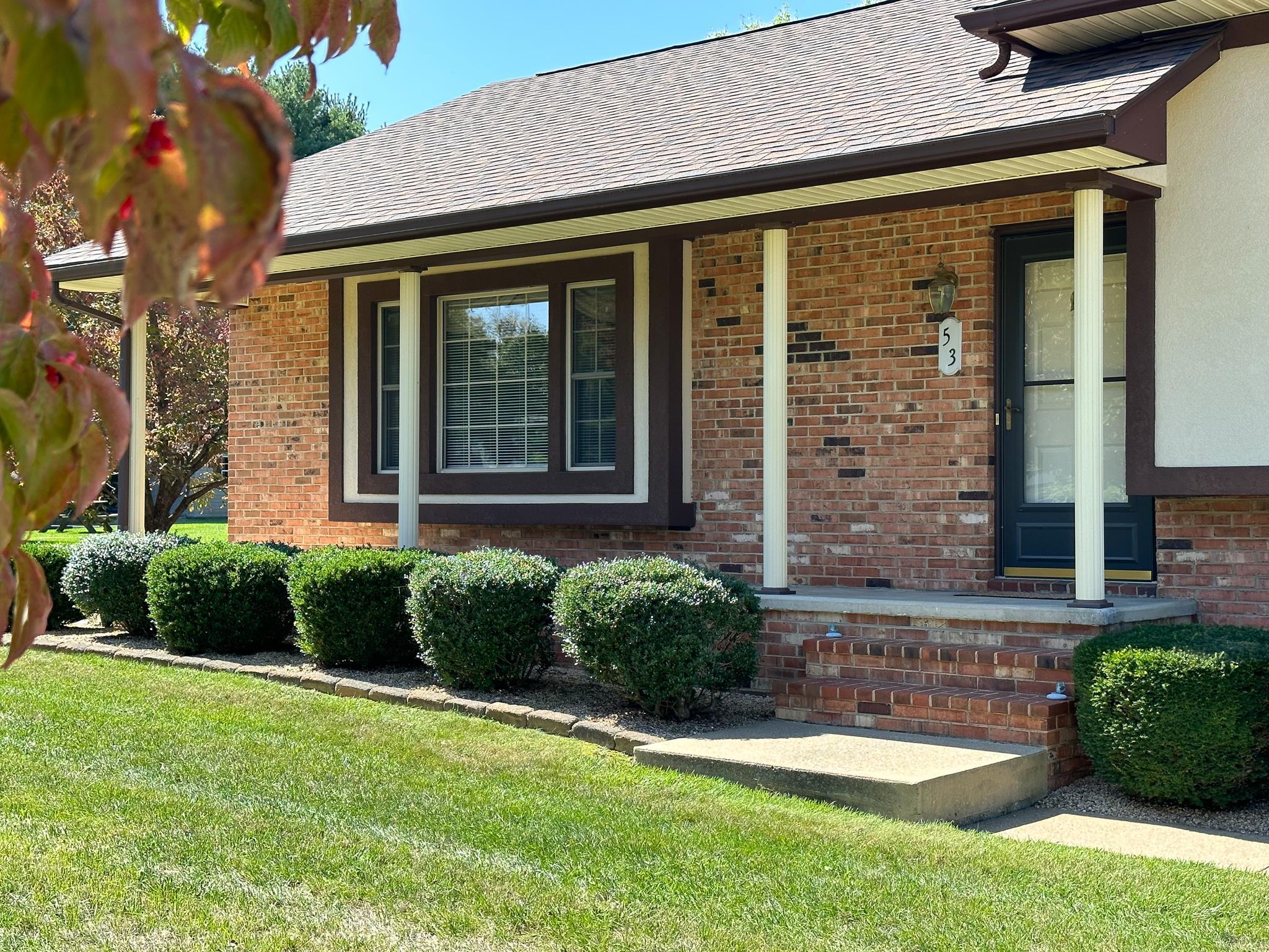 53 Cooper Drive Stuarts Draft, VA 24477 - Photo 2 of 31 a front view of a house with garden