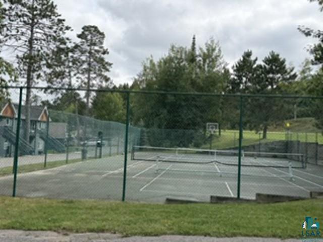 6266 Giants Ridge Road Biwabik, MN 55705 - Photo 28 of 30 Tennis court with perimeter fencing, asphalt surface, and net