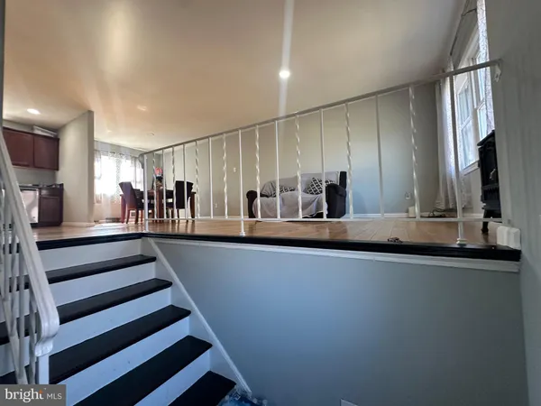 a view of a living room and kitchen