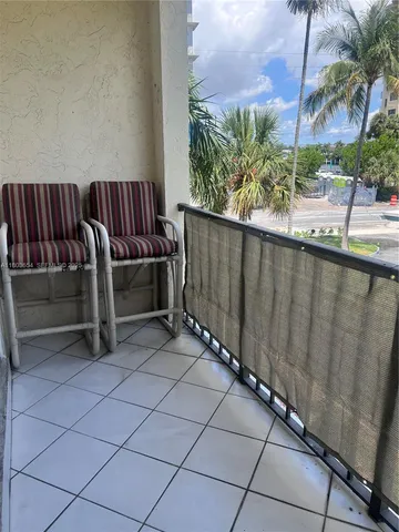 a view of swimming pool with sitting area