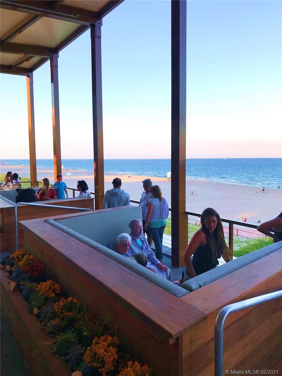 400 North Riverside Drive, Unit 214 Pompano Beach, FL 33062 - Photo 62 of 72 a view of a living room with furniture and floor to ceiling window