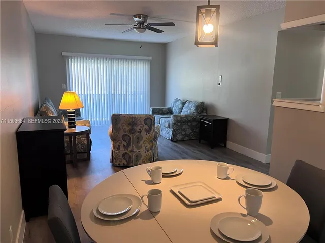 a view of a yard with potted plants