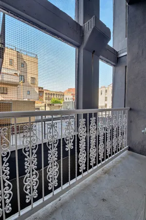 a view of a balcony with an outdoor view