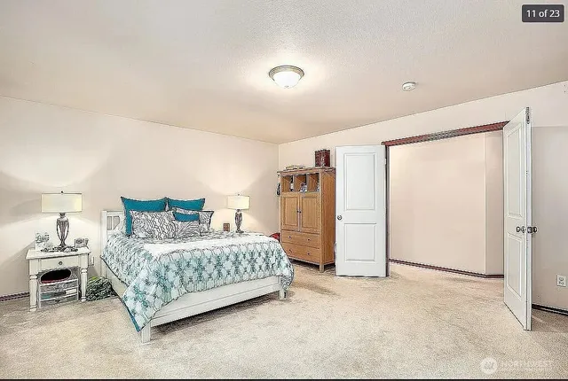 a bedroom with a bed and a cabinets