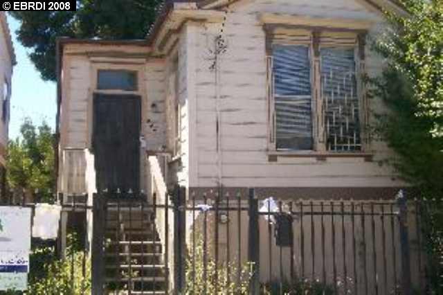 a front view of a house with a fence
